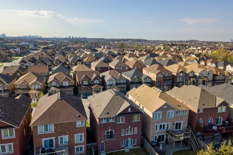 Row after row after row of single-family residences, with the high rises of the city of Toronto looming far in the background.